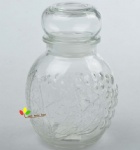 Glass jar with lid embossed design